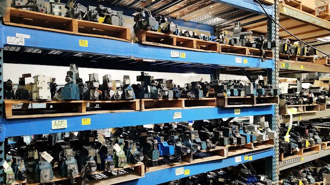 Shelves stocked with various industrial servo valves