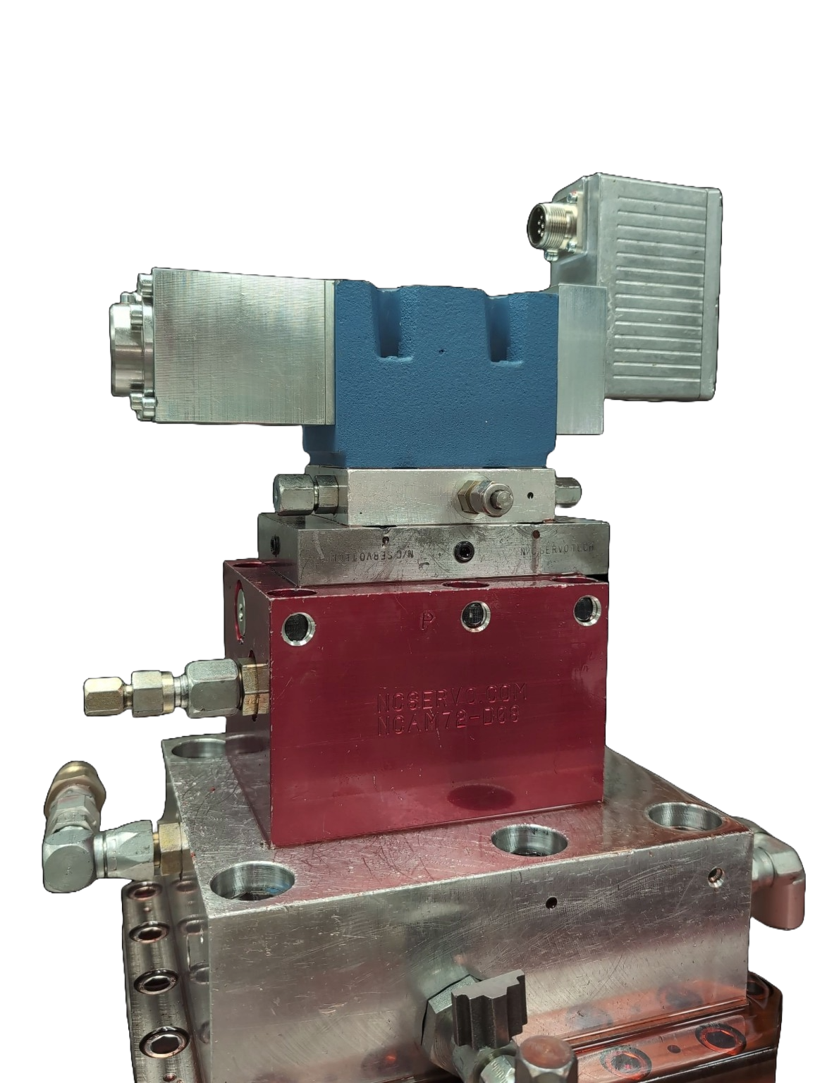 A technician interfacing with a modern servo valve with digital controls at an NC Servo Technology testing station.