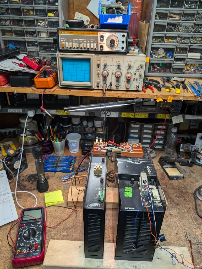 Electronics test stand with instruments for servo drive verification