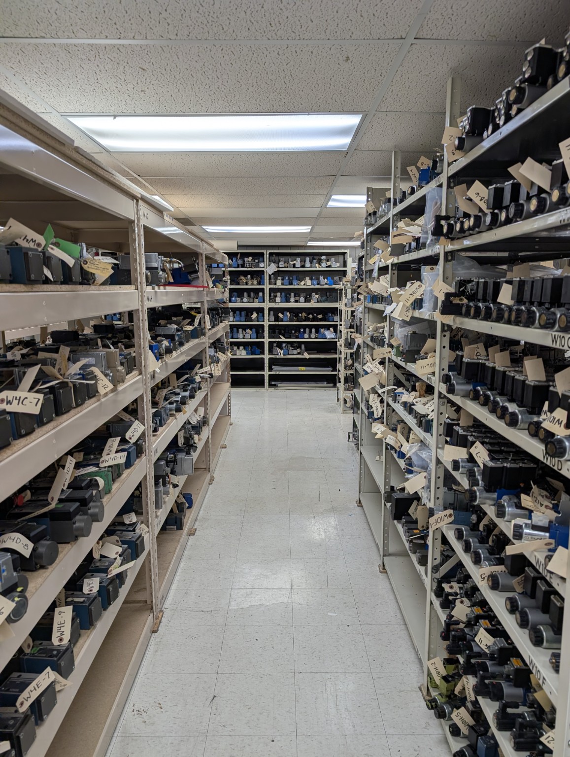 Warehouse shelves with valve inventory
