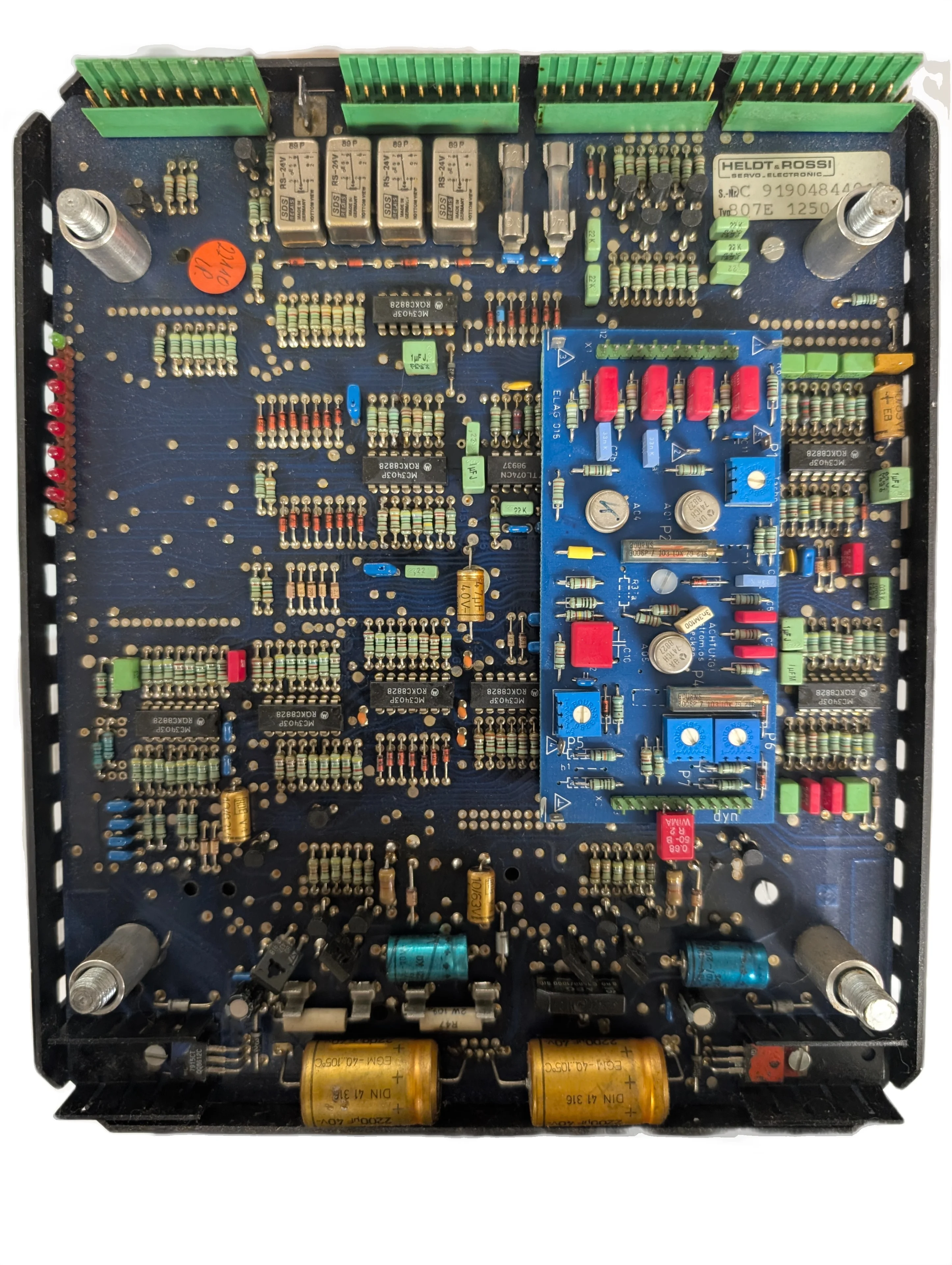 Heldt and Rossi 807E top-down view showing intricate blue circuit board with capacitors, resistors, and trim potentiometers