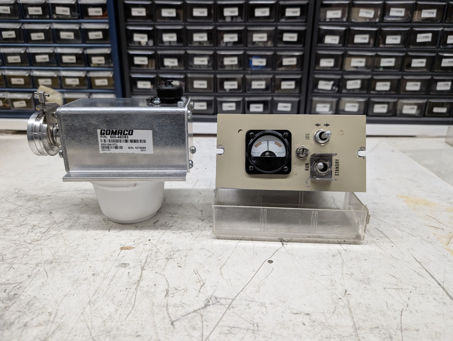 GOMACO P/N 500-46D83 (Sauer Sundstrand MCX103A1077J) electronic control module on the bench at NC Servo Technology, used in slipform concrete pavers and curb-and-gutter machines