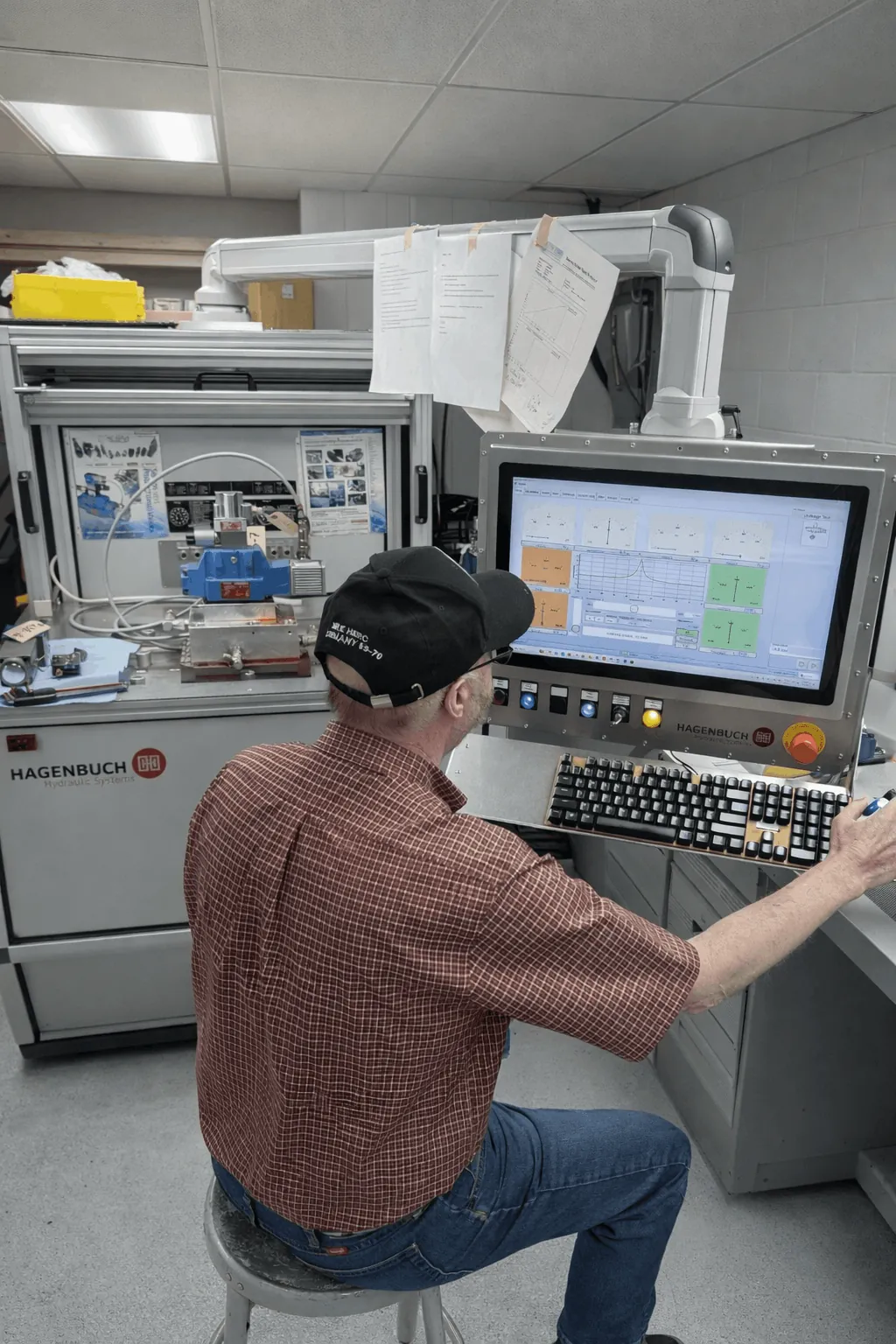 Eddie Harmon working at the Hagenbuch proportional valve test stand at NC Servo Technology